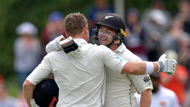 New Zealand's batsman Henry Nicholls (L) celebrates his century (100 runs) with a teammate Tom Latham during day three of the second Test cricket match between New Zealand and Sri Lanka at Hagley Park Oval.(AFP)