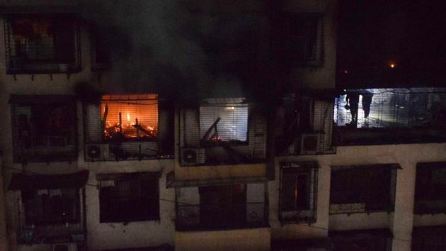 Five senior citizens died in a major fire that broke out in a 15-storey residential building located at Tilak Nagar in north east Mumbai on Thursday evening. This is the fourth major fire incident that took place in Mumbai in the past four days. The incident occurred just two days before the first anniversary of the Kamala Mills fire last year. (STR / AFP) Five senior citizens died in a major fire that broke out in a 15-storey residential building located at Tilak Nagar in north east Mumbai on Thursday evening. This is the fourth major fire incident that took place in Mumbai in the past four days. The incident occurred just two days before the first anniversary of the Kamala Mills fire last year. (STR / AFP)