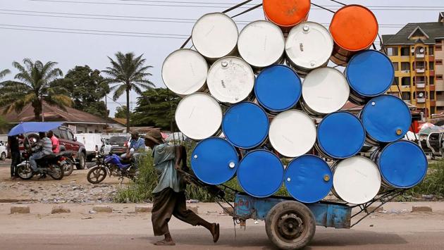 A man pulls a cart with barrels in Kinshasa, Democratic Republic of Congo. (Baz Ratner / REUTERS) A man pulls a cart with barrels in Kinshasa, Democratic Republic of Congo. (Baz Ratner / REUTERS)
