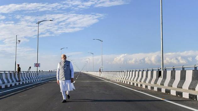 Prime Minister Narendra Modi strolls on the Bogibeel Bridge, the longest rail-cum-road bridge on Brahmaputra river, after it was inaugurated in Dibrugarh, Assam. (PIB Twitter / PTI) Prime Minister Narendra Modi strolls on the Bogibeel Bridge, the longest rail-cum-road bridge on Brahmaputra river, after it was inaugurated in Dibrugarh, Assam. (PIB Twitter / PTI)