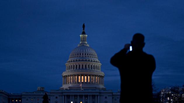 A visitor takes a photograph of the US Capitol in Washington, DC, on Thursday. (Bloomberg) A visitor takes a photograph of the US Capitol in Washington, DC, on Thursday. (Bloomberg)
