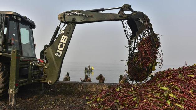 An army crane being used to weed out Dal Lake on a cold, winter morning, in Srinagar, Jammu and Kashmir. Army has extended help to the efforts to save the Dal Lake which has allegedly shrunk to less than half its original size due to pollution and human interference. (PTI) An army crane being used to weed out Dal Lake on a cold, winter morning, in Srinagar, Jammu and Kashmir. Army has extended help to the efforts to save the Dal Lake which has allegedly shrunk to less than half its original size due to pollution and human interference. (PTI)