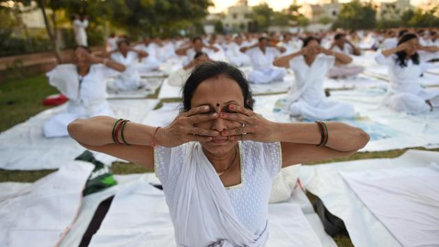 Women participate in a Yoga session marking the Mahila Yoga Shakti Divas at Nikol, in Ahmedabad, Gujarat. (Sam Panthaky / AFP) Women participate in a Yoga session marking the Mahila Yoga Shakti Divas at Nikol, in Ahmedabad, Gujarat. (Sam Panthaky / AFP)