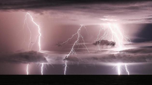 Lighting bolts striking along the Sunda Strait between the Indonesian islands of Java and Sumatra in Rajabasa, in Lampung province, three days after a tsunami. (Mohd Rasfan / AFP) Lighting bolts striking along the Sunda Strait between the Indonesian islands of Java and Sumatra in Rajabasa, in Lampung province, three days after a tsunami. (Mohd Rasfan / AFP)