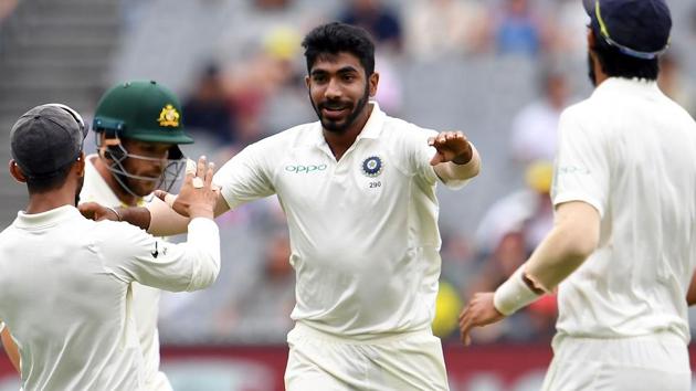 India's paceman Jasprit Bumrah (C) celebrates with teammates after taking the wicket of Australia's batsman Aaron Finch (2nd L) during day four of the third cricket Test match between Australia and India in Melbourne. (AFP)