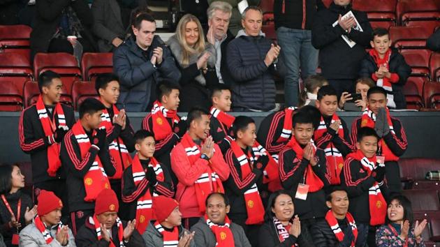 Thai coach Ekkapol Chantawong (C) and members of the "Wild Boars" football team take their seats in the stand for the English Premier League football match between Manchester United and Everton at Old Trafford in Manchester, north west England, on October 28. (AFP File photo) Thai coach Ekkapol Chantawong (C) and members of the "Wild Boars" football team take their seats in the stand for the English Premier League football match between Manchester United and Everton at Old Trafford in Manchester, north west England, on October 28. (AFP File photo)