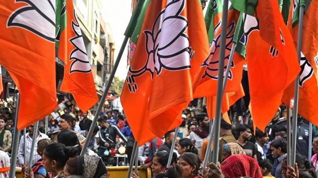 Supporters of the Bharatiya Janata Party (BJP) carry flags during a rally in Bhopal, Madhya Pradesh on November 21.(Bloomberg) Supporters of the Bharatiya Janata Party (BJP) carry flags during a rally in Bhopal, Madhya Pradesh on November 21.(Bloomberg)