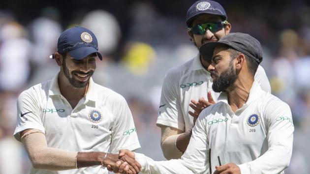 India's captain Virat Kohli, right, shakes hands with Jasprit Bumrah. (AP) India's captain Virat Kohli, right, shakes hands with Jasprit Bumrah. (AP)