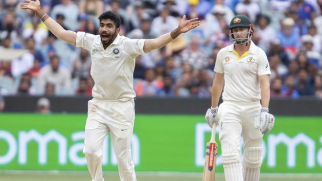 India's Jasprit Bumrah, left, appeals an LBW after bowling to Shaun Marsh during play on day four of the third cricket test between India and Australia in Melbourne. (AP)