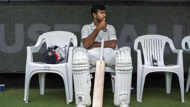 India's Mayank Agarwal sits on the bench before the start of play on day four of the third cricket test between India and Australia in Melbourne.(AP) India's Mayank Agarwal sits on the bench before the start of play on day four of the third cricket test between India and Australia in Melbourne.(AP)