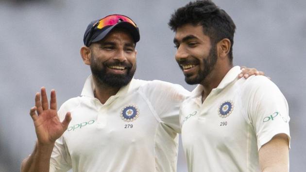 Melbourne : India's Mohammed Shami, left, speaks with Jasprit Bumrah during play on day four.(AP)