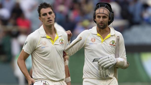 Australia's Pat Cummins, left, and Nathan Lyon walk off the field at the end of play during play on day four of the third cricket test between India and Australia in Melbourne. (AP) Australia's Pat Cummins, left, and Nathan Lyon walk off the field at the end of play during play on day four of the third cricket test between India and Australia in Melbourne. (AP)