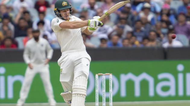 Australia's Tim Paine plays a shot during play on day four of the third cricket test between India and Australia in Melbourne. (AP)