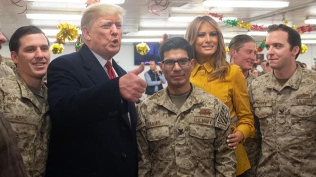 US President Donald Trump and First Lady Melania Trump greet members of the US military during an unannounced trip to Al Asad Air Base in Iraq on December 26, 2018. (AFP Photo) US President Donald Trump and First Lady Melania Trump greet members of the US military during an unannounced trip to Al Asad Air Base in Iraq on December 26, 2018. (AFP Photo)