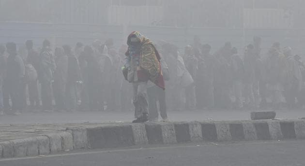 An elderly man wrapped in warm clothes on a cold, foggy morning, in New Delhi on December 23.(PTI Photo)