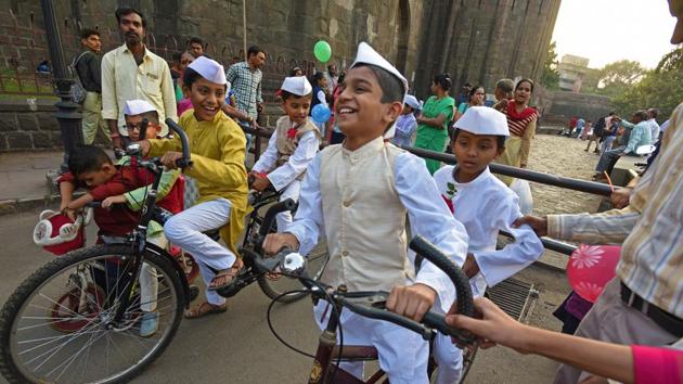 Children dressed as Jawaharlal Nehru, the first Prime Minister of independent India, share light moment at Shaniwar Wada on the eve of Children's Day or Bal Diwas . Every year, 14th November is celebrated as Children's day across India to mark birth anniversary of Nehru, popularly known as Chacha Nehru. (Pratham Gokhale/HT Photo) 