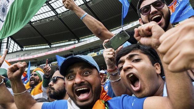 Indian cricket team supporters cheer and wave flags after India defeated Australia on day five of the third cricket test between India and Australia in Melbourne. (AP) Indian cricket team supporters cheer and wave flags after India defeated Australia on day five of the third cricket test between India and Australia in Melbourne. (AP)
