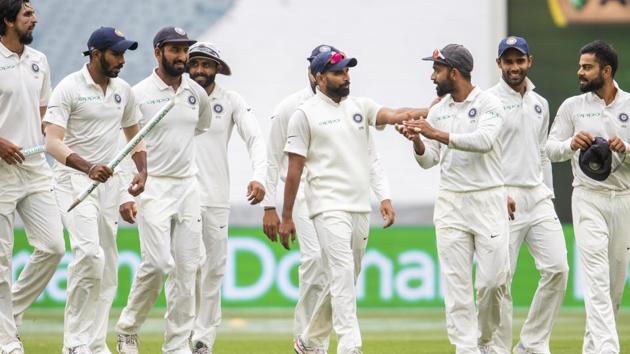 Indian team members walk off the field after beating Australia on day five of the third cricket test between India and Australia in Melbourne. (AP) Indian team members walk off the field after beating Australia on day five of the third cricket test between India and Australia in Melbourne. (AP)