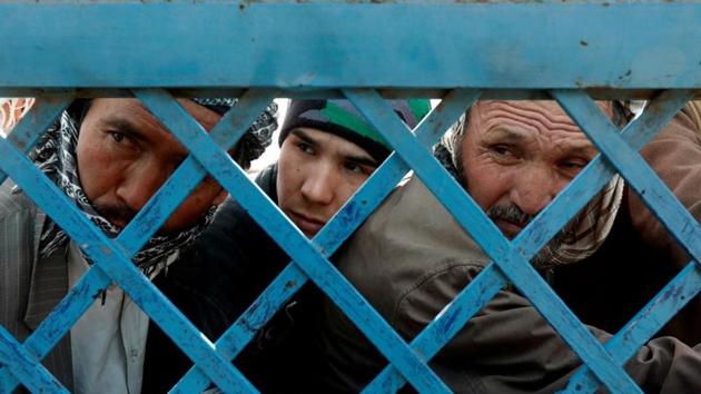 Afghan men line up to cast their votes during a parliamentary election at a polling station in Kabul, Afghanistan October 21.(REUTERS) Afghan men line up to cast their votes during a parliamentary election at a polling station in Kabul, Afghanistan October 21.(REUTERS)