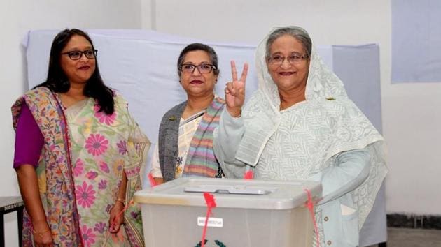 Prime Minister Sheikh Hasina gestures after casting her vote in the morning during the general election in Dhaka, Bangladesh on December 30.(REUTERS)