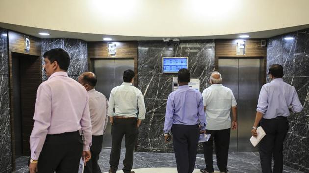 Visitors wait for elevators the Bombay Stock Exchange BSE building in Mumbai. (Bloomberg) Visitors wait for elevators the Bombay Stock Exchange BSE building in Mumbai. (Bloomberg)