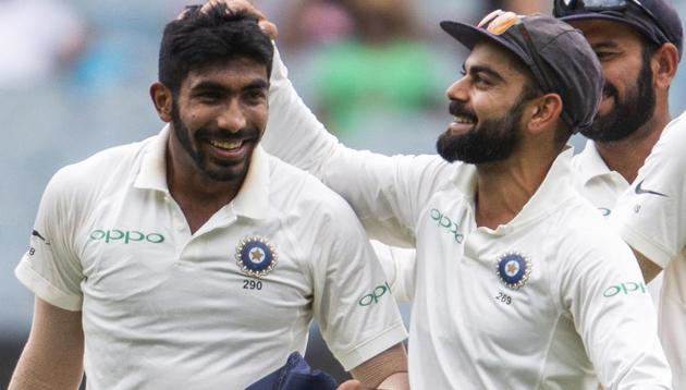 India's captain Virat Kohli, right, celebrates Jasprit Bumrah, left, after the dismissal of Australia's Shaun Marsh.(AP)