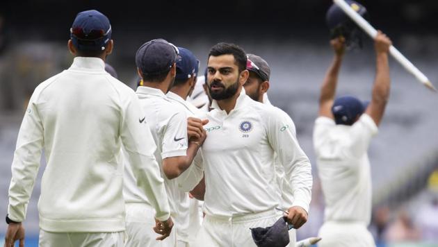 Indian players celebrate after winning the third Test against Australia at the MCG on Sunday.(AP)