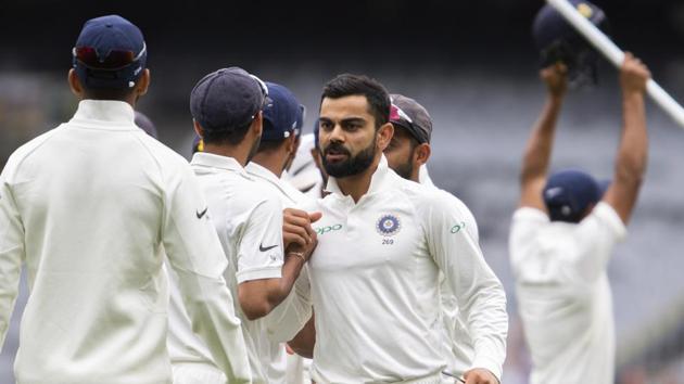 India's captain Virat Kohli, center, congratulates his teammates after India defeated Australia on day five of the third cricket test between India and Australia in Melbourne. (AP) India's captain Virat Kohli, center, congratulates his teammates after India defeated Australia on day five of the third cricket test between India and Australia in Melbourne. (AP)