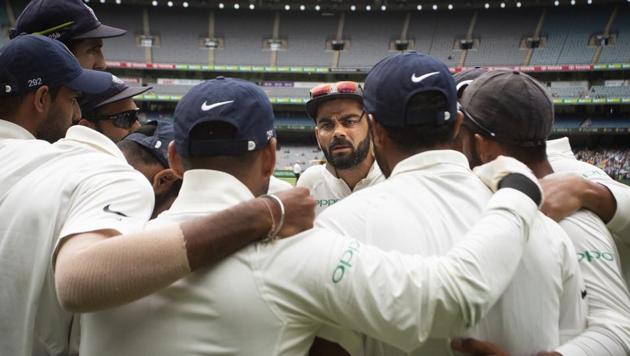 India's captain Virat Kohli, center, addresses his teammates as they prepare to take to the field during play on day four of the third cricket test between India and Australia in Melbourne, Australia, Saturday, Dec. 29, 2018)(AP)