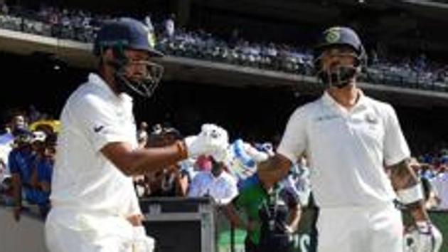 File image of Virat Kohli and Cheteshwar Pujara. (AFP) File image of Virat Kohli and Cheteshwar Pujara. (AFP)