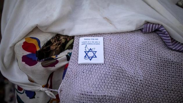 A booklet of Psalm 119:105 is left on a self-made tent at a temporary shelter in Tijuana, Mexico. Some Mexican border towns are perilous places to wait, plagued with crime and violence. But many migrants, bolstered by their faith, say they are undaunted. (Alkis Konstantinidis / Reuters) A booklet of Psalm 119:105 is left on a self-made tent at a temporary shelter in Tijuana, Mexico. Some Mexican border towns are perilous places to wait, plagued with crime and violence. But many migrants, bolstered by their faith, say they are undaunted. (Alkis Konstantinidis / Reuters)