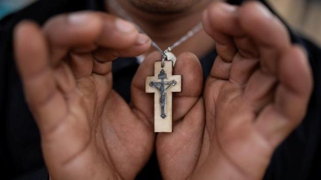 Since setting out from Honduras in the hope of reaching the United States, Nicolas Alonso Sanchez has worn a simple wooden cross around his neck – a quiet reminder of the Roman Catholic faith that propels him forward. “God gave me the strength to get all the way here,” said Sanchez. On the long journey from Central America to US soil, many migrants have taken solace in religion. (Alkis Konstantinidis / Reuters) Since setting out from Honduras in the hope of reaching the United States, Nicolas Alonso Sanchez has worn a simple wooden cross around his neck – a quiet reminder of the Roman Catholic faith that propels him forward. “God gave me the strength to get all the way here,” said Sanchez. On the long journey from Central America to US soil, many migrants have taken solace in religion. (Alkis Konstantinidis / Reuters)