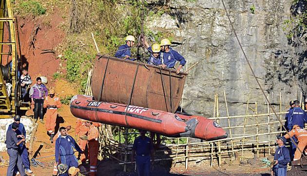 Indian Navy personnel come out of the coal mine in Ksan, Meghalaya, where at least 15 miners are stuck in a deep mine.(REUTERS)