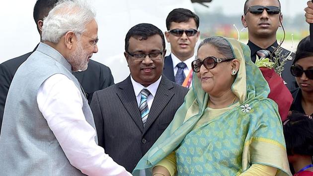 Prime Minister Narendra Modi is received by his Bangladeshi counterpart, Sheikh Hasina Wajid, at the Hazrat Shahjalal International Airport in Dhaka.(AFP File Photo)