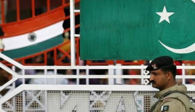 A Pakistani Ranger stands near the Pakistani flag and Indian flag.(REUTERS file phoot) A Pakistani Ranger stands near the Pakistani flag and Indian flag.(REUTERS file phoot)