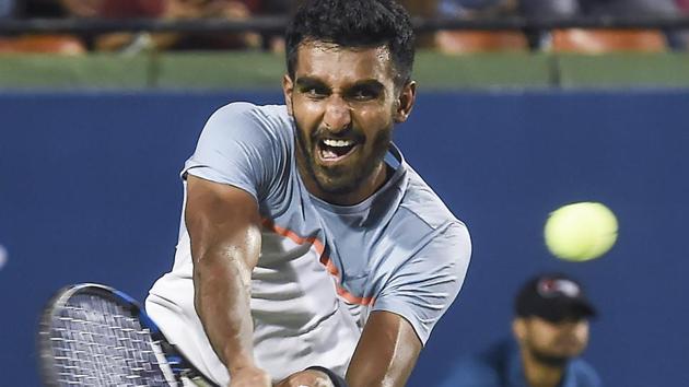 Prajnesh Gunneswaran plays a shot against Canada's Brayden Schnur.(AP)