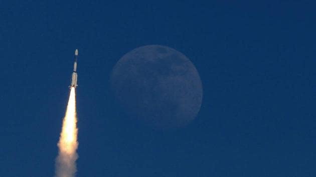 The Indian military communication satellite GSAT-7A is pictured next to the moon as it is launched into orbit on the Indian Space Research Organisation (ISRO)'s Geosynchronous Satellite Launch Vehicle (GSLV) in Sriharikota in the state of Andhra Pradesh on December 19, 2018.(AFP Photo)