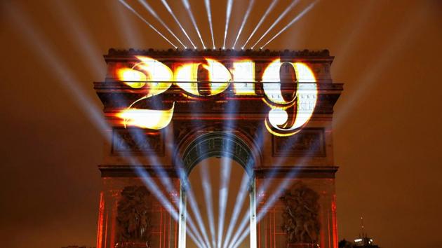 The Arc de Triomphe is lit during New Year's celebrations in Paris, France. (Christian Hartmann / Reuters) 