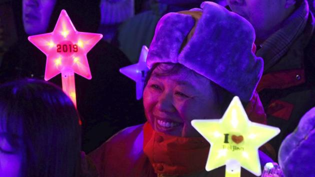 A reveler prepares to countdown to the New Year in Beijing, China. (Ng Han Guan / AP Photo) 