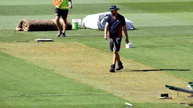 Melbourne Cricket Ground (MCG) curator Matt Page walks over the wicket ahead of the third Test between India and Australia.(AFP) Melbourne Cricket Ground (MCG) curator Matt Page walks over the wicket ahead of the third Test between India and Australia.(AFP)