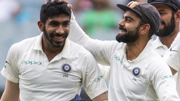 Virat Kohli, right, celebrates Jasprit Bumrah, left, after Bumrah got the wicket of Australia's Shaun Marsh.(AP)