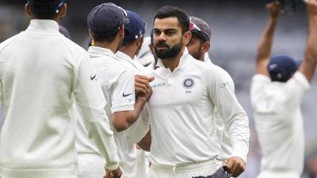 India's captain Virat Kohli, center, congratulates his teammates after India defeated Australia in Melbourne. (AP) India's captain Virat Kohli, center, congratulates his teammates after India defeated Australia in Melbourne. (AP)