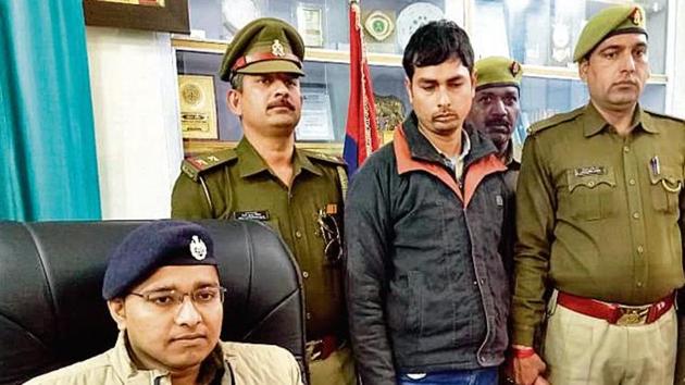 (Standing, second from left) Karamveer, a former lineman with NTPC, in police custody. He was fired in last July for alleged irregularities.