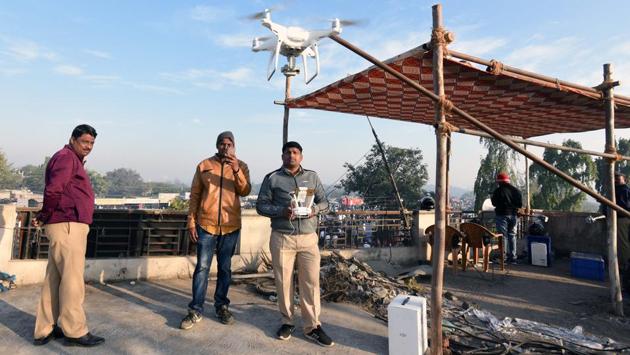 Police personnel fly a drone camera at VijayStambh during the 201st anniversary of the Bhima Koregaon battle on Tuesday. (Pratham Gokhale/HT Photo) Police personnel fly a drone camera at VijayStambh during the 201st anniversary of the Bhima Koregaon battle on Tuesday. (Pratham Gokhale/HT Photo)