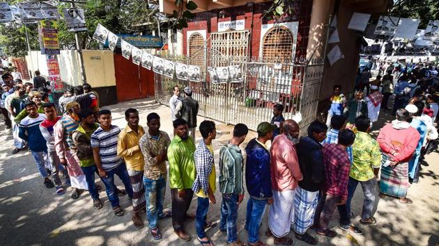 Voters wait in line outside a polling station. Image for representation. (AFP file photo) Voters wait in line outside a polling station. Image for representation. (AFP file photo)