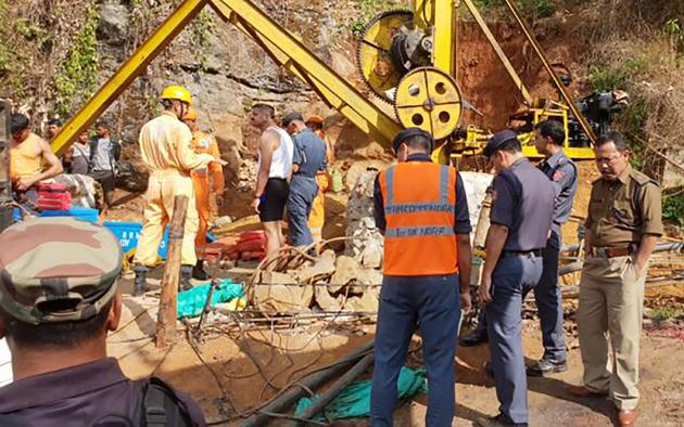This undated file handout photo from the National Disaster Response Force released to AFP on December 17, 2018, shows emergency workers gathering around a crane after 15 miners were trapped by flooding in an illegal coal mine in Ksan village in Meghalaya's East Jaintia Hills district(AFP) This undated file handout photo from the National Disaster Response Force released to AFP on December 17, 2018, shows emergency workers gathering around a crane after 15 miners were trapped by flooding in an illegal coal mine in Ksan village in Meghalaya's East Jaintia Hills district(AFP)