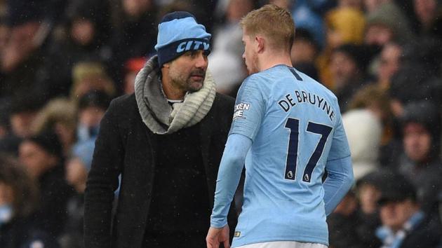 Manchester City's Spanish manager Pep Guardiola gives instructions to Manchester City's Belgian midfielder Kevin De Bruyne during a English Premier League football match.(AFP)