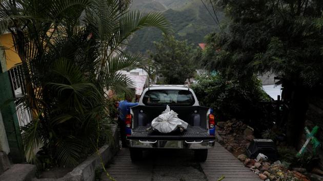 As he continued taking the photos, the air felt increasingly uncomfortable. Finally, tensions eased when one of Blanco’s friends intervened, saying that the grieving family had authorized Garrido’s presence. (Edgard Garrido / REUTERS) As he continued taking the photos, the air felt increasingly uncomfortable. Finally, tensions eased when one of Blanco’s friends intervened, saying that the grieving family had authorized Garrido’s presence. (Edgard Garrido / REUTERS)