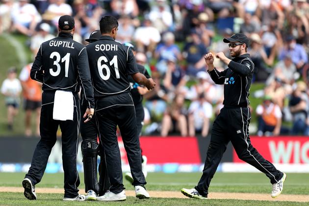 Kane Williamson (R), captain of New Zealand, and team-mate Ish Sodhi celebrate the dismissal of Josh Buttler of England during game four of the One Day International series between New Zealand and England at University of Otago Oval on March 7, 2018 in Dunedin, New Zealand.(Getty Images)