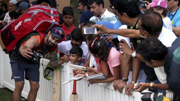 India skipper Virat Kohli poses with fans during a training session in Sydney on Wednesday. (AP) India skipper Virat Kohli poses with fans during a training session in Sydney on Wednesday. (AP)